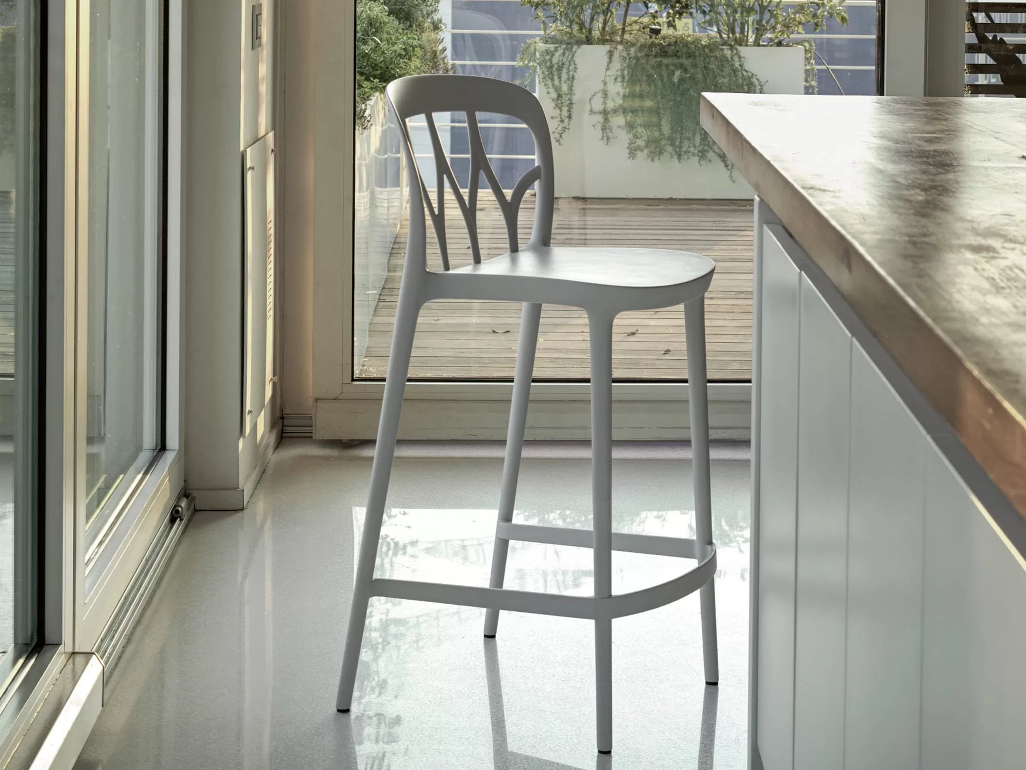 Galaxy Footstool Low stacking barstool in polypropylene and recyclable glass fibre