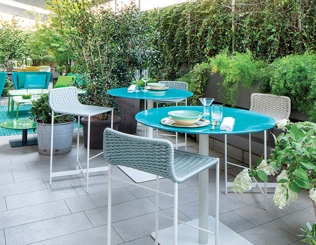 Paolo Lenti Dining Furniture in an outdoor garden settting